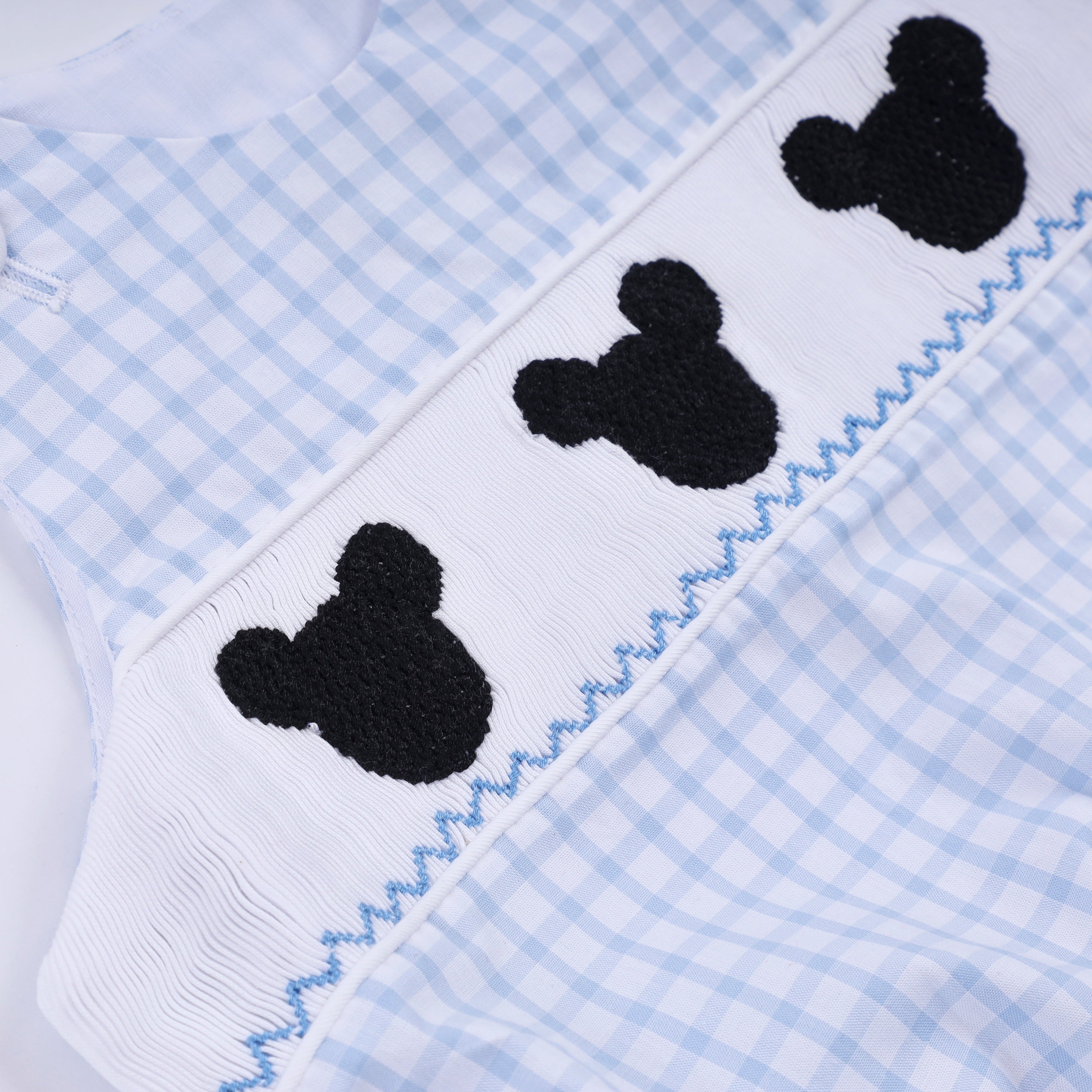 Blue character hand smocked gingham bubble